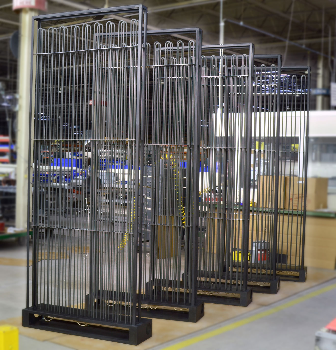 Five, large, custom process heaters on a shop floor
